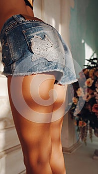 Female sensuality woman legs buttocks denim shorts