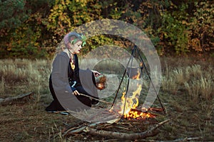 Female shaman prepares a magic potion