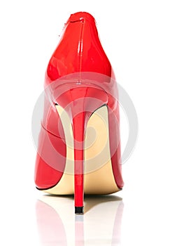 Female shiny red stilettos on a white background