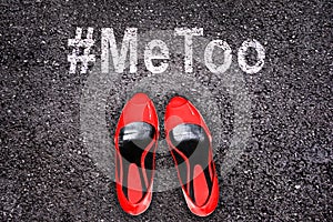 Female shoes on asphalt, hashtag MeToo photo