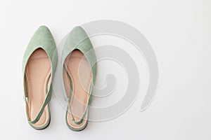 Female shoes in delicate mint color on a white background