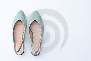 Female shoes in delicate mint color on a white background