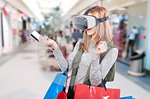 Female shopper experiencing virtual reality equipment video