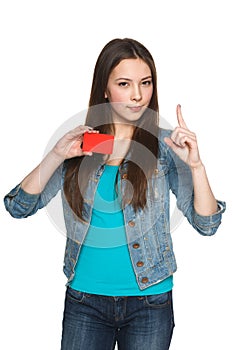 Female showing blank credit card with finger up