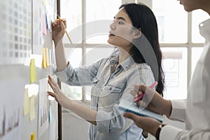 Female showing plan in project management