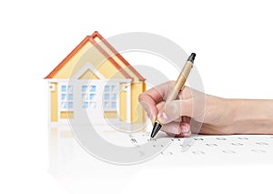 Female signing contract on a house