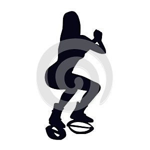 Female silhouette doing squat in kangoo jump boots. Girl doing strength exercise in bounce shoes during HIIT