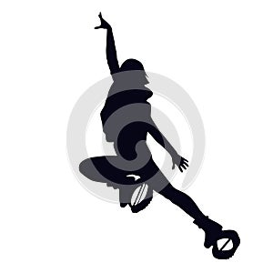 Female silhouette doing straddle jump or lounge in kangoo jump boots. Girl dancing in bounce shoes during HIIT photo