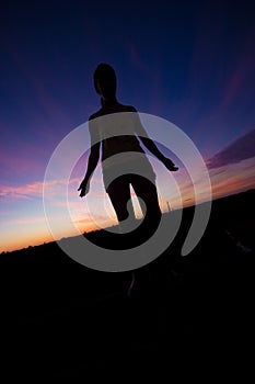 Female silhouette at sunset