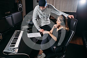 Female singer listen song record in music studio