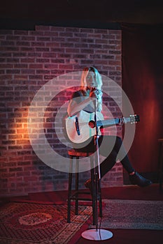 Female singer performing illuminated nightclub