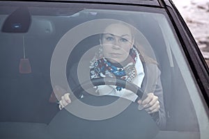 Female sitting in car