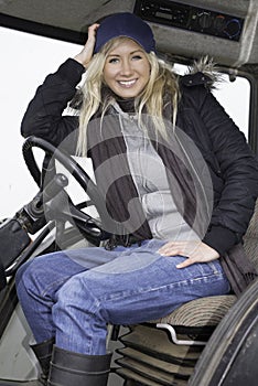 Female sitting in a tractor