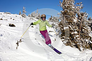 Female skier descending the hill