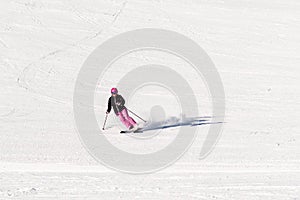 Female skier on empty ski slope