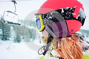 Female skier enjoying beautiful mountain scene