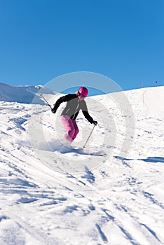 Female skier in fresh powder snow