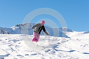 Female skier in fresh powder snow