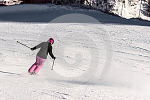 Female skier in fresh powder snow