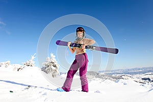 Female skier topless standing on the heel