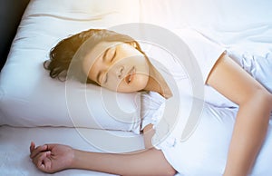 Women sleeping on the bed and grinding teeth,Female tiredness and stress photo