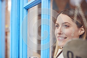 Female Small Business Owner Turning Around Open Sign On Shop Or Store Door