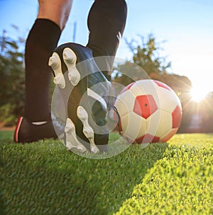 Female soccer football. Woman athlete ready to kick the ball