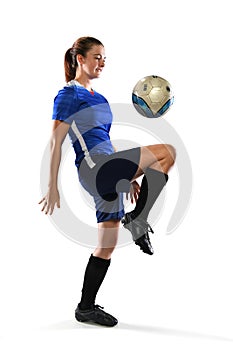 Female Soccer Player Bouncing Ball