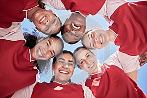Female soccer team in a huddle smiling in unity and support in a circle. Below portrait of an active and diverse group