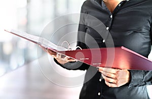 Female social worker, detective or business woman reading files. photo