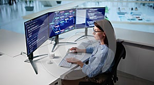 Female Software Engineer Coding Website On Desktop Computer