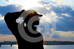 Female soldier in uniform saluting outdoors. Military