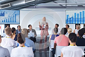 Female speaker speaks in a business seminar