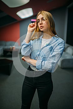 Female spectator in 3d glasses, cinema hall