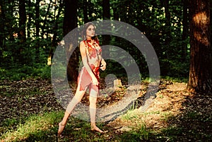 Female spirit mythology. Forest fairy. Living wild life untouched nature. Wild woman in forest. Sexy girl early stage in