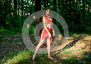 Female spirit mythology. Wild woman in forest. Sexy girl early stage in the evolutionary development. Culture of wild