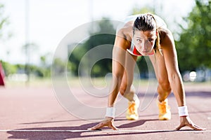 Female sprinter getting ready for the run