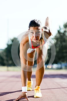 Female sprinter getting ready for the run