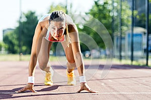 Female sprinter getting ready for the run