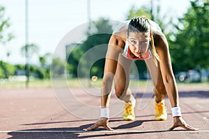 Female sprinter getting ready for the run