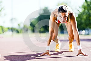 Female sprinter getting ready for the run