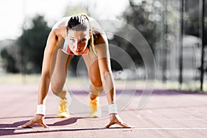 Female sprinter getting ready for the run