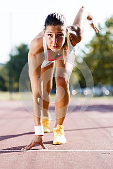 Female sprinter getting ready for the run
