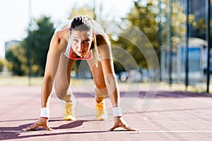 Female sprinter getting ready for the run