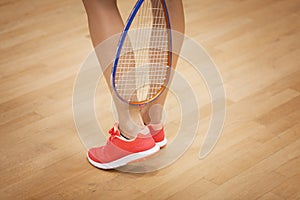 Female squash player playing squash