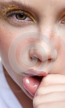Female squeezes face mouth by hand