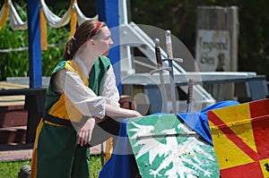 Female Squire Assisting Jousters at Renaissance Festival