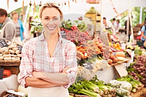 Female Stall Holder At Farmers Fresh Food Market