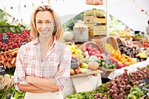 Female Stall Holder At Farmers Fresh Food Market