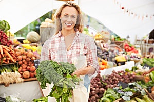 Female Stall Holder At Farmers Fresh Food Market